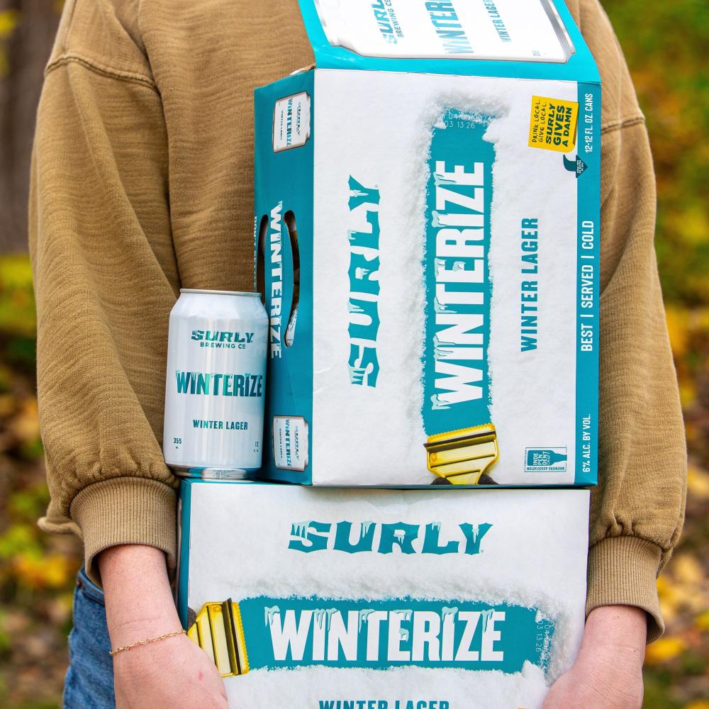 Girl holding pack of Winterize beer