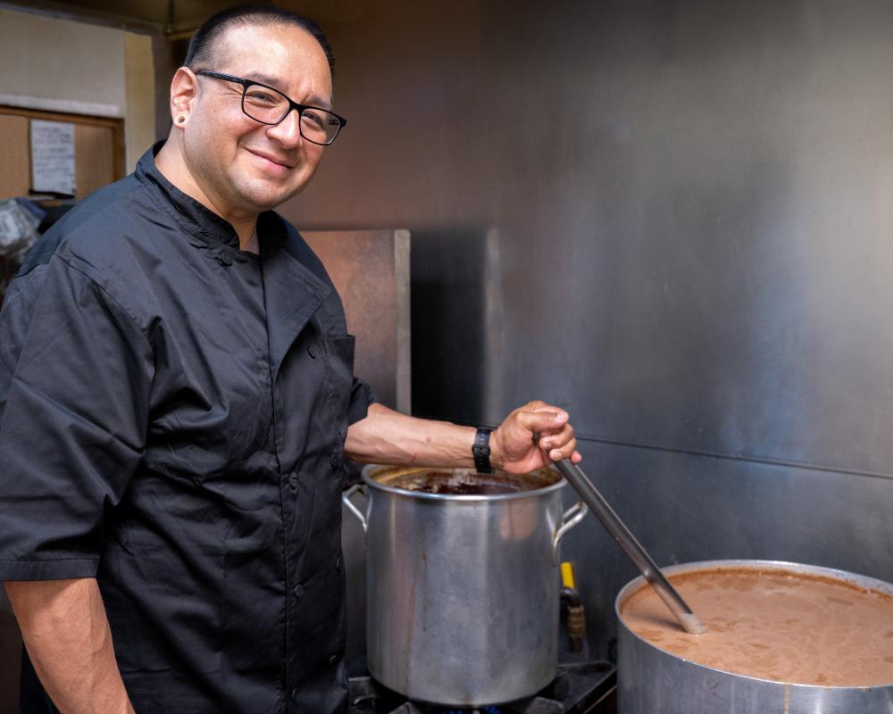 Person in cooking in kitchen