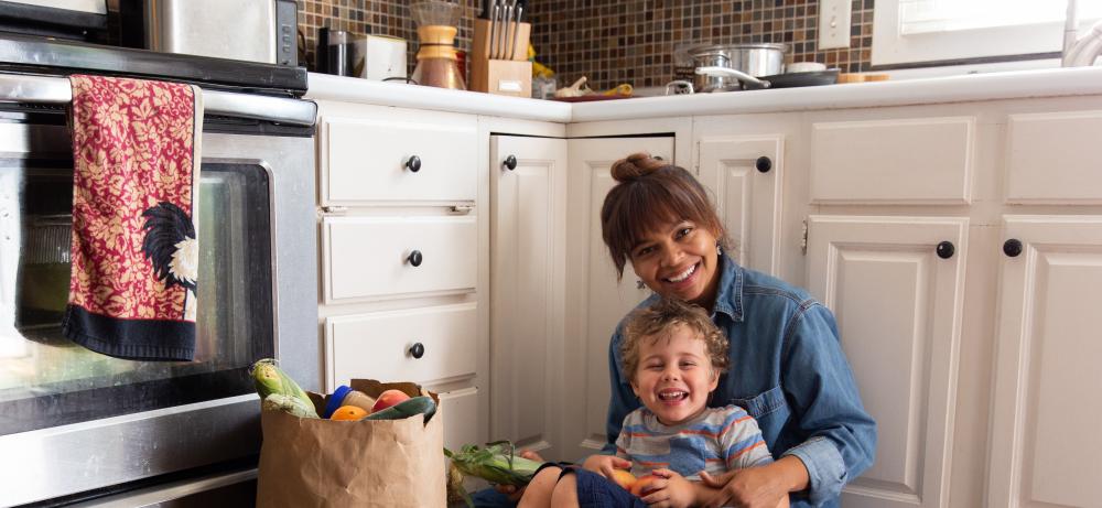 Person sitting on floor with child
