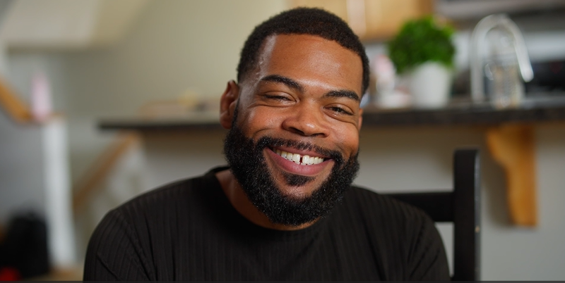 A man smiling at the camera