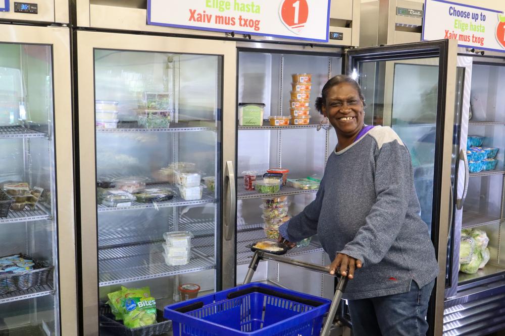 An adult shopping inside of a food shelf