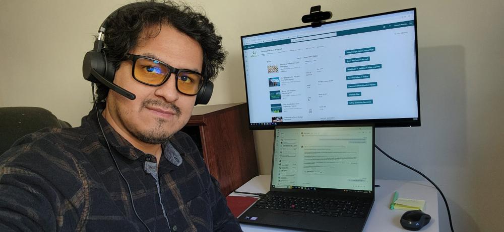 A Care Center worker at his computer