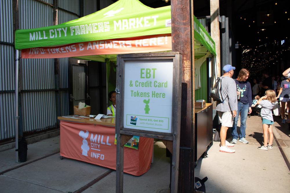 A Market Bucks sign at a Farmers Market