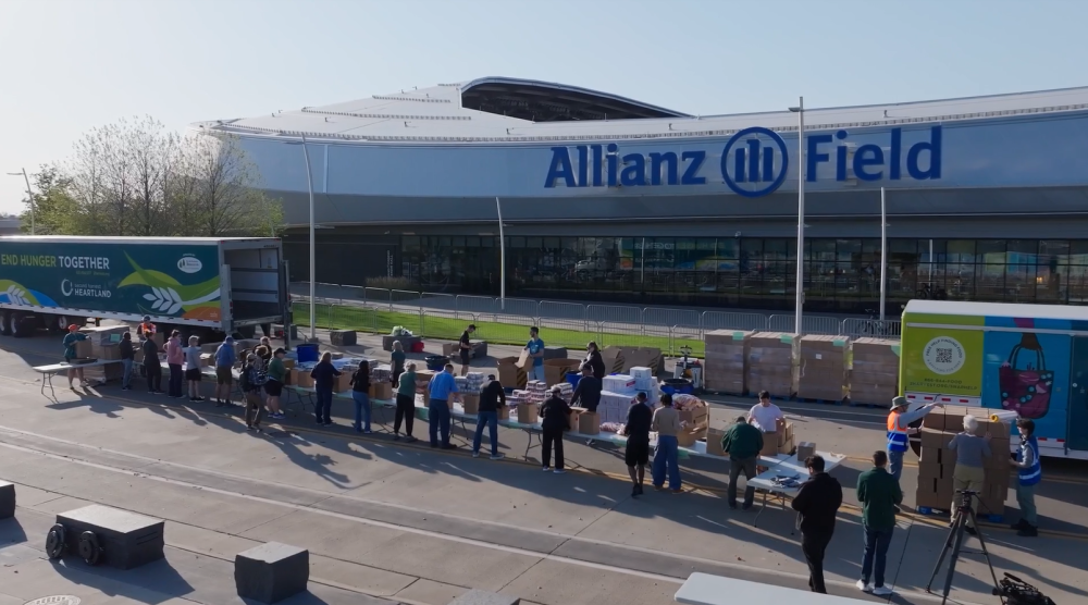 Volunteers packing food boxes outside Allianz Field
