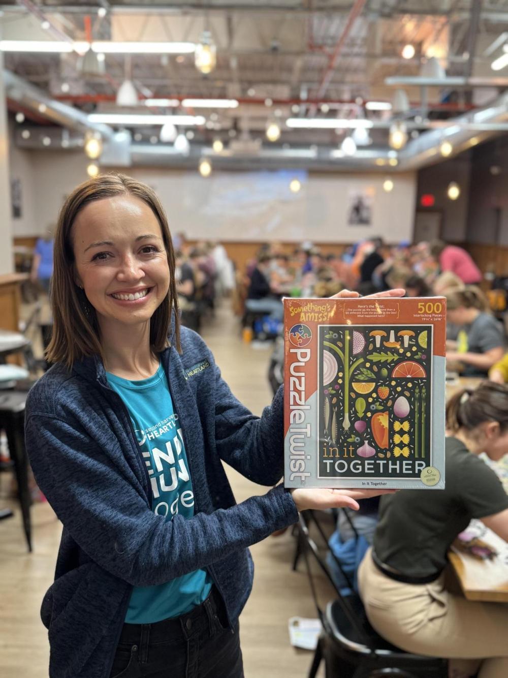 Woman holding up puzzle box