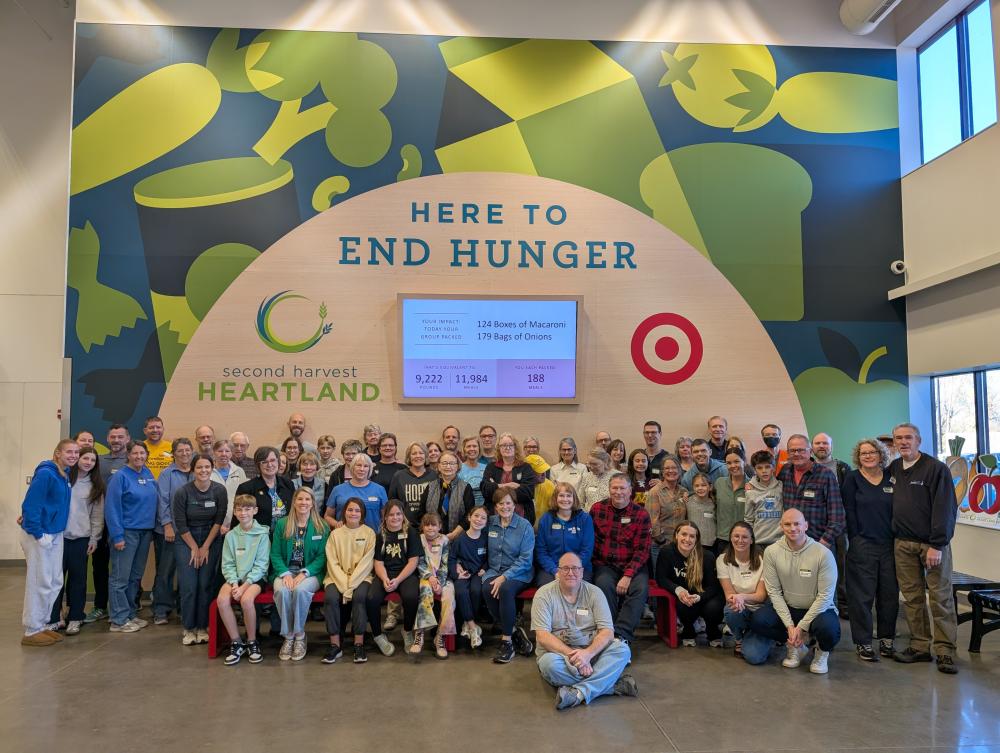 A large group of donors posing for a photo after a volunteer shift