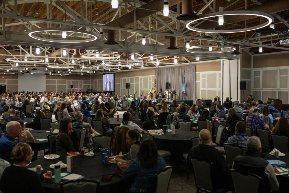 Large room full of people at the 2026 Summit