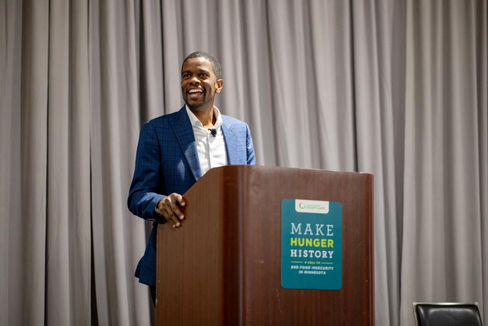 Melvin Carter giving a speech in front of a wooden podium