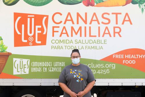 A portrait of Janelle Calvo in front of the Clues truck