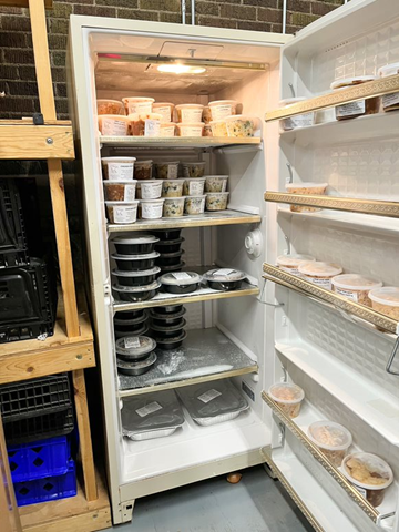 Fridge holding prepared meals from the Wooden Spoon