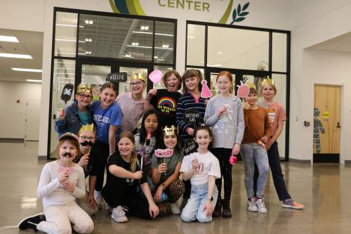 A group of girls volunteering at Second Harvest Heartland for Charli's birthday