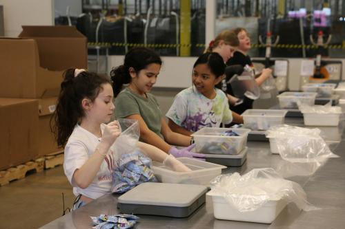 Three girls volunteering for Charli's birthday party