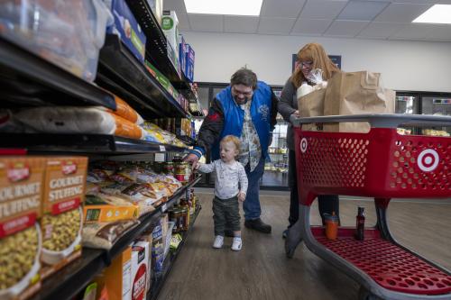 Family picks out groceries at food shelf