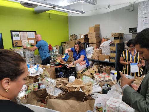 Volunteer packing food at Sanctuary Haven Pantry