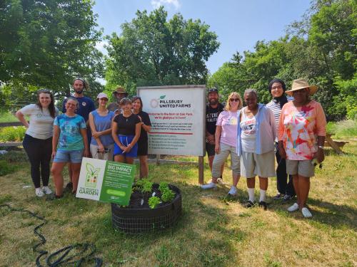 Volunteer group posing together at Pillsbury United Communities' Oak Park Community Cafe