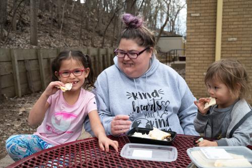 Alissa enjoys a Kitchen Coalitions meal with her children