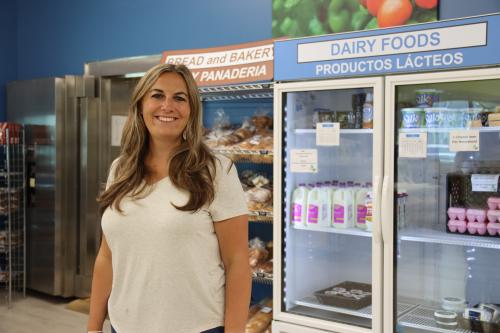 Executive Director Angie Cruzen standing in the Gather and Grow Waconia United Food Shelf