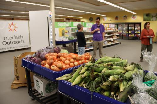 Crates of onions and corn in a food shelf