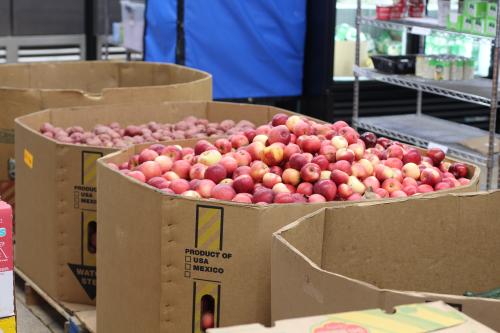 Apples and potatoes in cardboard containers