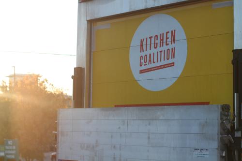 The back of a Kitchen Coalition truck as the sun rises