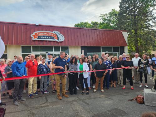 Community Market ribbon cutting in front of crowd