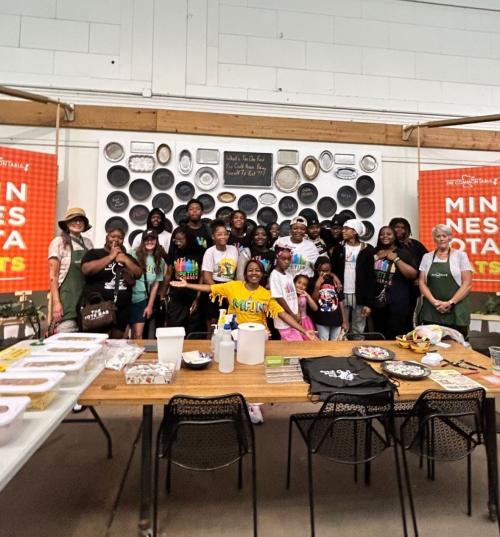 Volunteers at the State Fair in front of a table