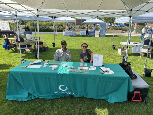Volunteers work at a voter engagement booth