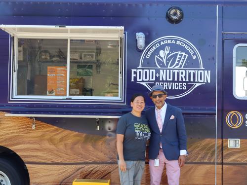 Osseo Area Schools Food Truck Irfan Chaudhry and Bri O'Brien in front of the food truck